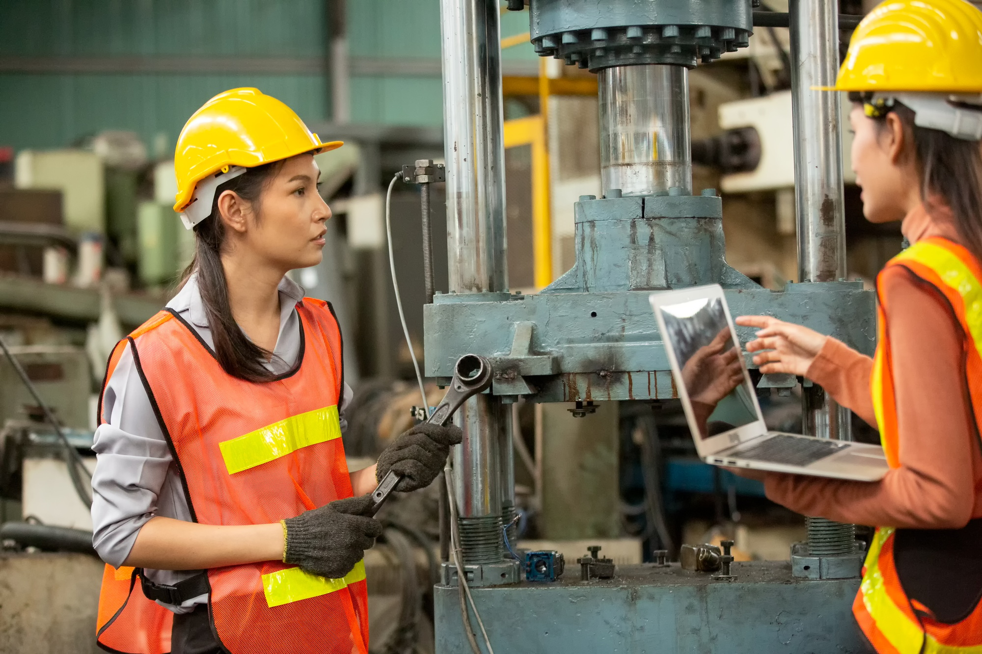 industrial factory worker working in metal manufacturing industry