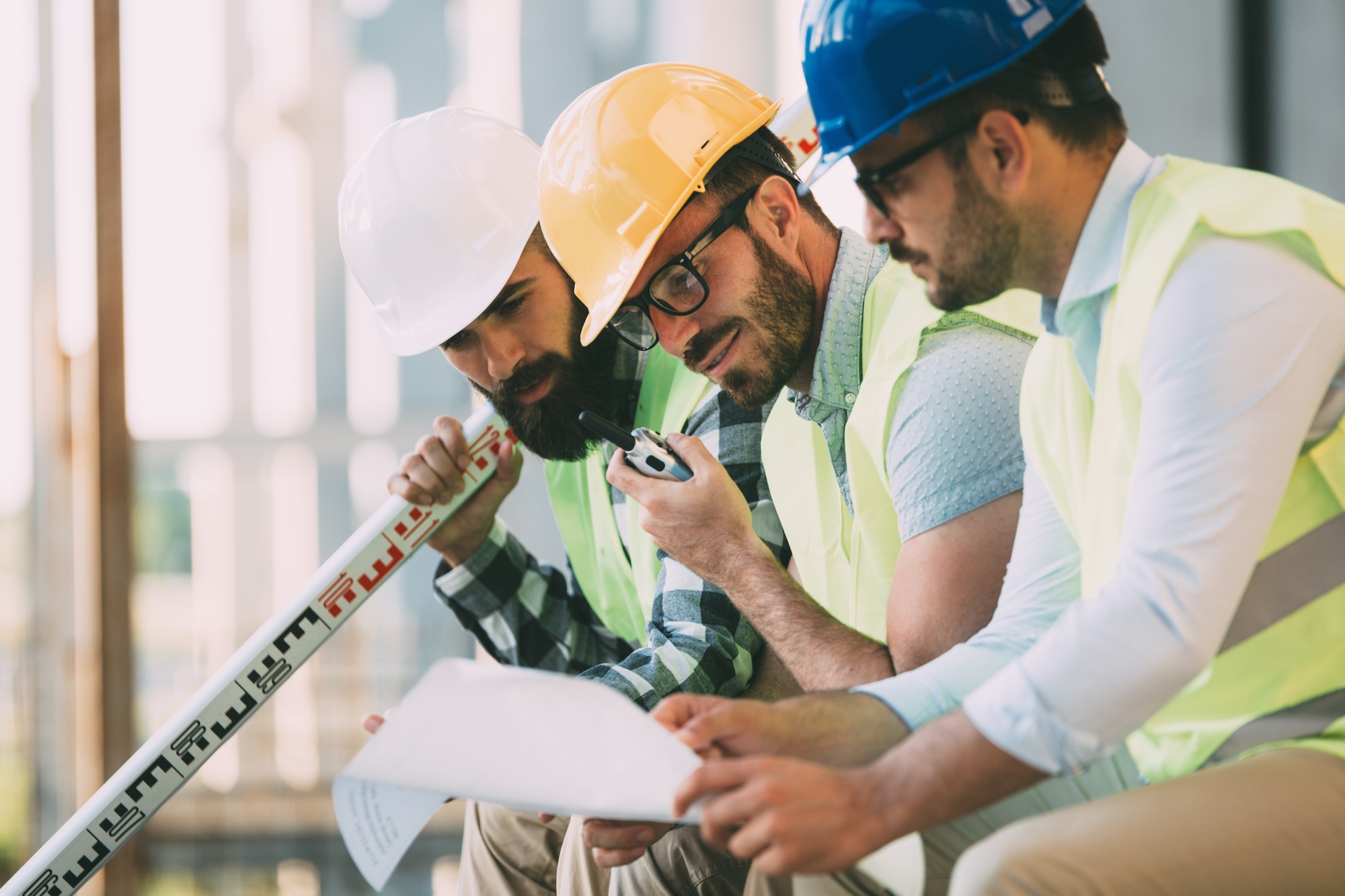 Portrait of construction engineers working on building site