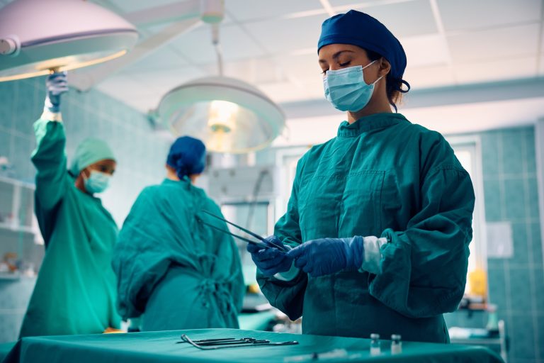 Surgical nurse during an operation in the hospital.