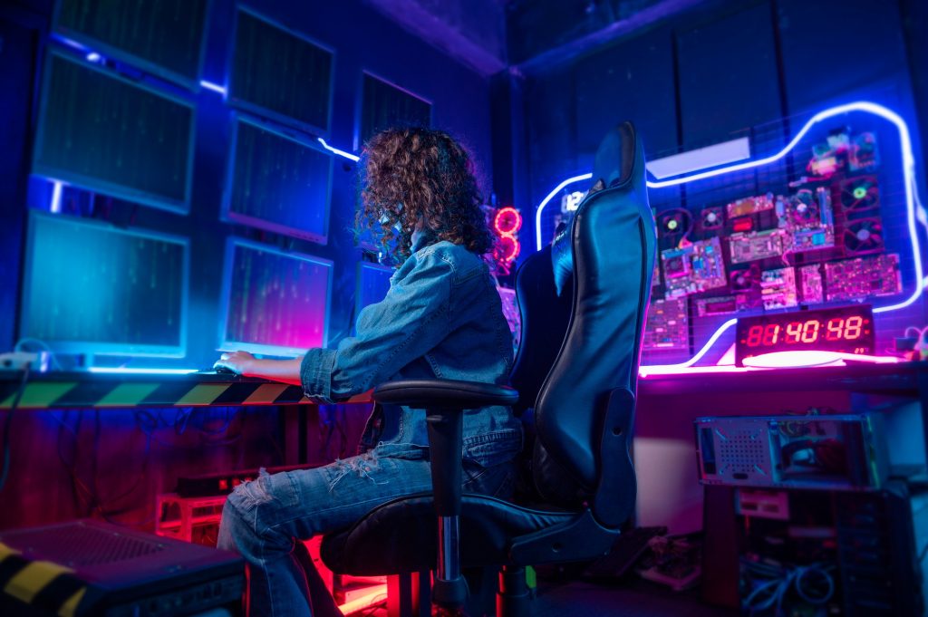 Woman programmer is working in her computer room