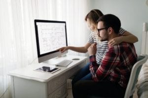 Young attractive designers working together from home