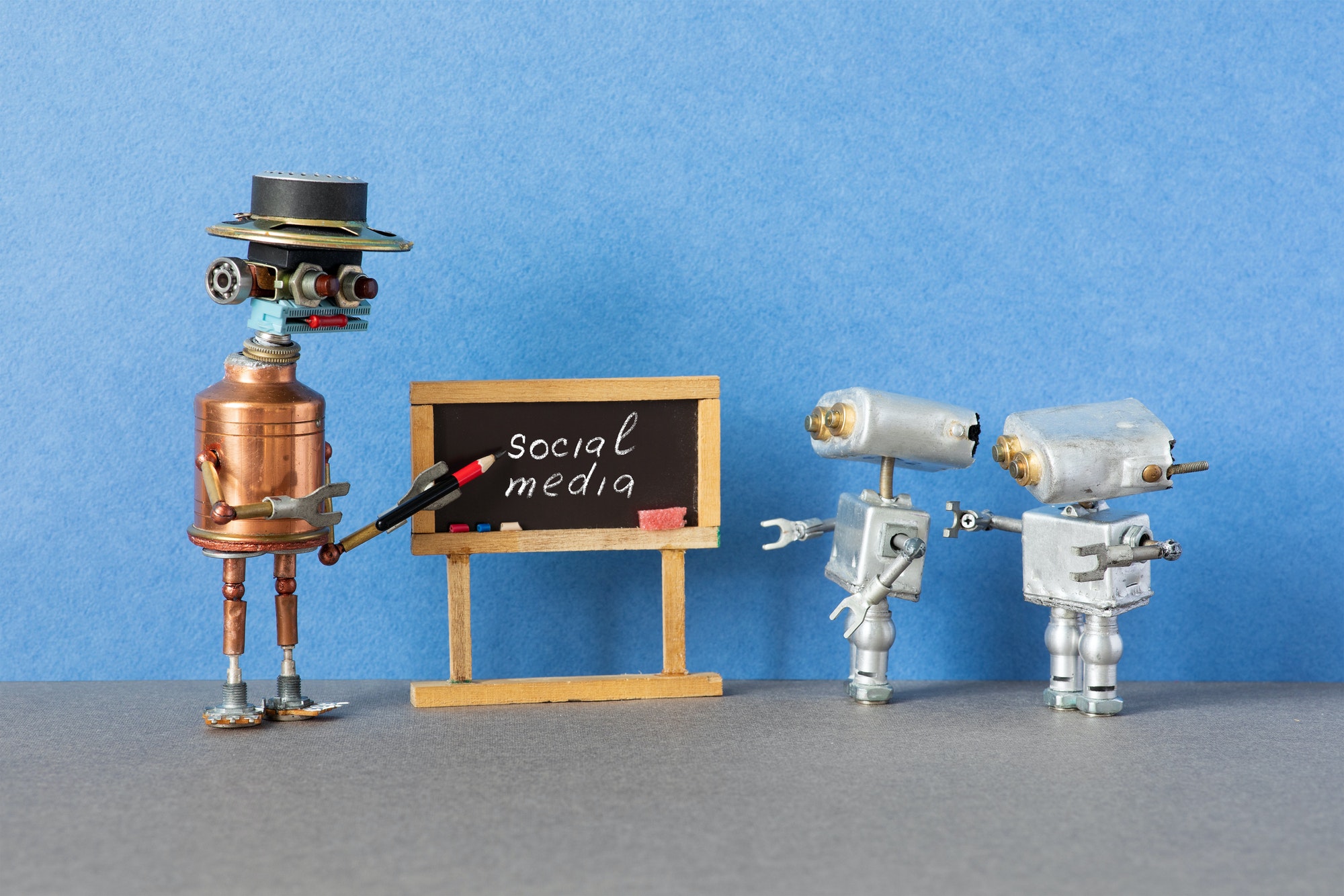 Robot professor explains the concept of social media.