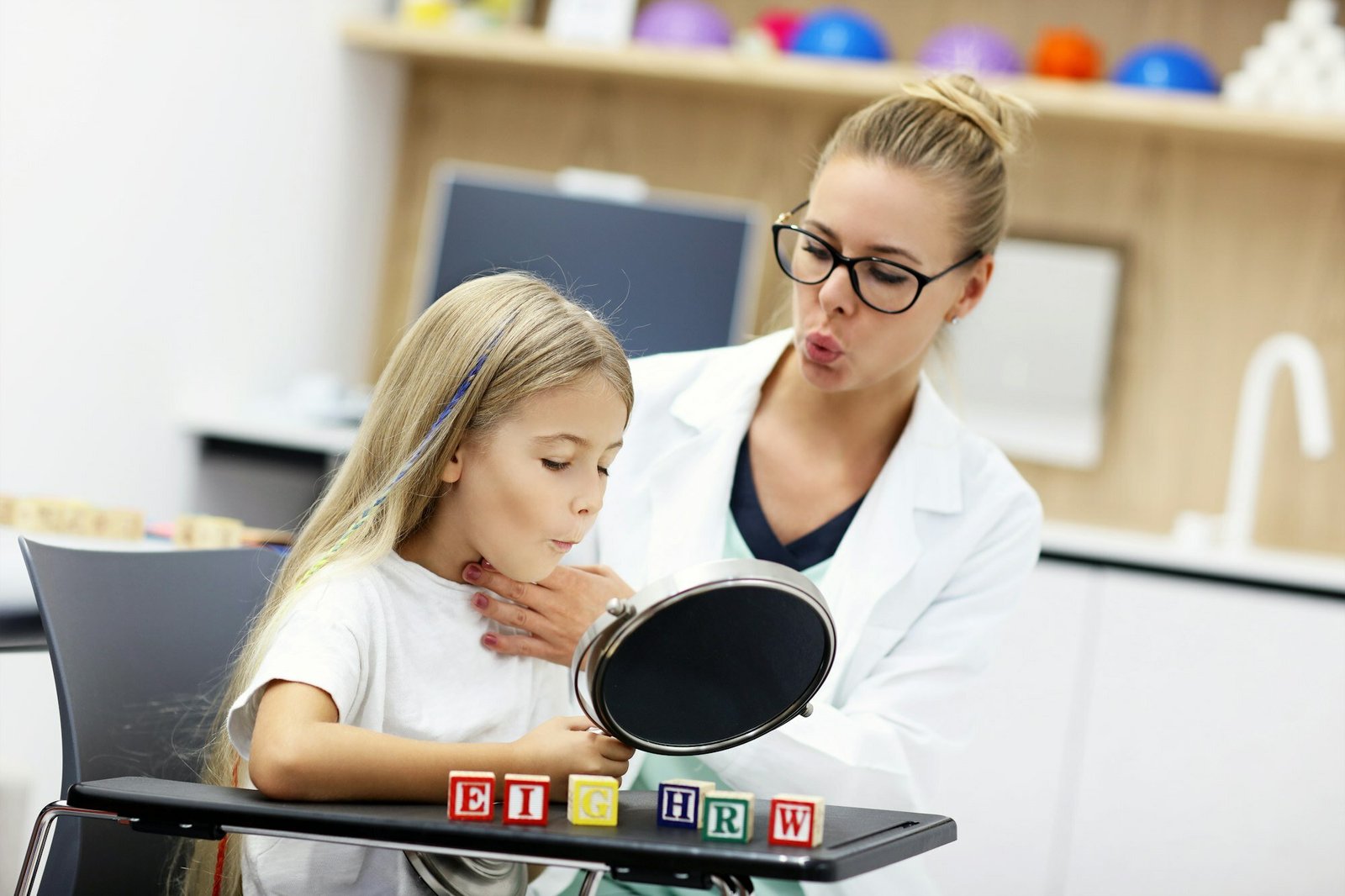 Cute little girl at speech therapist office